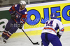 Rok Ticar (no.24) of Slovenia (L) and Jonathan Weaver (no.14) of Great Britain (R) during ice hockey match of IIHF Ice hockey World championships Division I, group B between Great Britain and Slovenia. Match between Great Britain and Slovenia of IIHF Ice hockey World championships Division I, group B was held on Tuesday, 20th of April 2010 in Ljubljana, Slovenia.
