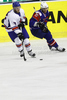 Robert Dowd (no.12) of Great Britain (L) and Ziga Pavlin (no.17) of Slovenia (R) during ice hockey match of IIHF Ice hockey World championships Division I, group B between Great Britain and Slovenia. Match between Great Britain and Slovenia of IIHF Ice hockey World championships Division I, group B was held on Tuesday, 20th of April 2010 in Ljubljana, Slovenia.
