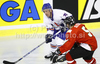 Ashley Tait (no.21) of Great Britain (L) and Viktor Szelig (no.5) of Hungary (R) during ice hockey match of IIHF Ice hockey World championships Division I, group B between Great Britain and Hungary. Match between Great Britain and Hungary of IIHF Ice hockey World championships Division I, group B was held on Wednesday, 21st of April 2010 in Ljubljana, Slovenia.
