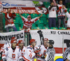 Players of Poland celebrating their goal, with fans in background during ice hockey match of IIHF Ice hockey World championships Division I, group B between Great Britain and Poland. Match between Great Britain and Poland of IIHF Ice hockey World championships Division I, group B was held on Friday, 23rd of April 2010 in Ljubljana, Slovenia.
