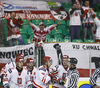 Players of Poland celebrating their goal, with fans in background during ice hockey match of IIHF Ice hockey World championships Division I, group B between Great Britain and Poland. Match between Great Britain and Poland of IIHF Ice hockey World championships Division I, group B was held on Friday, 23rd of April 2010 in Ljubljana, Slovenia.
