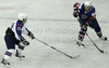 Jan Urbas (no.26) of Slovenia (R) and Yoon Hwan Kim (no.10) of Korea (L) during ice hockey match of IIHF Ice hockey World championships Division I, group B between Slovenia and Korea. Match between Slovenia and Korea of IIHF Ice hockey World championships Division I, group B was held on Wednesday, 21st of April 2010 in Ljubljana, Slovenia.
