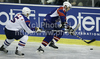 Tomaz Razingar (no.9) of Slovenia (R) and Woo Jae Kim (no.5) of Korea (L) during ice hockey match of IIHF Ice hockey World championships Division I, group B between Slovenia and Korea. Match between Slovenia and Korea of IIHF Ice hockey World championships Division I, group B was held on Wednesday, 21st of April 2010 in Ljubljana, Slovenia.
