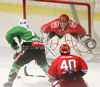 Thomas Ward Cardinal of Actoni Jesenice (R), John Hughes of Tilia Olimpija (L) and Goalkeeper of Actoni Jesenice Michal Fikrt  during ice hockey match Summer League Rudi Hiti (Poletna liga Rudi Hiti) 2011 between HDD Tilia Olimpija and HK Acroni Jesenice. Match between HDD Tilia Olimpija and HK Acroni Jesenice was held on Friday, 19th of August 2011 in Bled, Slovenia.
