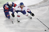 Tomaz Razingar (no.9) of Slovenia and Robert Dowd (no.12) of Great Britainduring match of IIHF Ice hockey World championship Division 1 Group A between Slovenia and Great Britain. Match between Slovenia and Great Britain of IIHF Ice hockey World championship Division 1 Group A was held in Stozice Arena in Ljubljana, Slovenia, on Sunday, 15th of April 2012.
