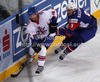 Daniel Meyers (no.16) of Great Britain (L) and Tomaz Razingar (no.9) of Slovenia (R) during match of IIHF Ice hockey World championship Division 1 Group A between Slovenia and Great Britain. Match between Slovenia and Great Britain of IIHF Ice hockey World championship Division 1 Group A was held in Stozice Arena in Ljubljana, Slovenia, on Sunday, 15th of April 2012.
