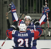 Tomaz Razingar (no.9) of Slovenia (back) celebrates his goal with his teammate Andrej Hebar (front) during match of IIHF Ice hockey World championship Division 1 Group A between Slovenia and Great Britain. Match between Slovenia and Great Britain of IIHF Ice hockey World championship Division 1 Group A was held in Stozice Arena in Ljubljana, Slovenia, on Sunday, 15th of April 2012.
