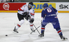 Mario Altmann (no.2) of Austria (L) and Craig Peacock (no.6) of Great Britain (R) during match of IIHF Ice hockey World championship Division 1 Group A between Austria and Great Britain. Match between Austria and Great Britain of IIHF Ice hockey World championship Division 1 Group A was held in Stozice Arena in Ljubljana, Slovenia, on Monday, 16th of April 2012.
