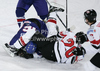 Daniel Welser (no.20) of Austria and Daniel Meyers (no.16) of Great Britainduring match of IIHF Ice hockey World championship Division 1 Group A between Austria and Great Britain. Match between Austria and Great Britain of IIHF Ice hockey World championship Division 1 Group A was held in Stozice Arena in Ljubljana, Slovenia, on Monday, 16th of April 2012.
