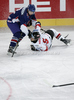 Mark Richardson (no.2) of Great Britain (L) stopping Thomas Raffl (no.5) of Austria (R) during match of IIHF Ice hockey World championship Division 1 Group A between Austria and Great Britain. Match between Austria and Great Britain of IIHF Ice hockey World championship Division 1 Group A was held in Stozice Arena in Ljubljana, Slovenia, on Monday, 16th of April 2012.
