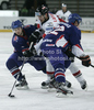 Manuel Latusa (no.15) of Austria (M) trying to attack between Mark Thomas (no.22) of Great Britain (R) and Mark Richardson (no.2) of Great Britain (L) during match of IIHF Ice hockey World championship Division 1 Group A between Austria and Great Britain. Match between Austria and Great Britain of IIHF Ice hockey World championship Division 1 Group A was held in Stozice Arena in Ljubljana, Slovenia, on Monday, 16th of April 2012.
