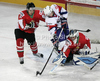 Ziga Jeglic (no.8) of Slovenia, Istvan Bartalis (no.28) of Hungary and Viktor Tokaji (no.6) of Hungary during match of IIHF Ice hockey World championship Division 1 Group A between Slovenia and Hungary. Match between Slovenia and Hungary of IIHF Ice hockey World championship Division 1 Group A was held in Stozice Arena in Ljubljana, Slovenia, on Wednesday, 18th of April 2012.
