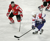 Viktor Tokaji (no.6) of Hungary and Marcel Rodman (no.22) of Slovenia during match of IIHF Ice hockey World championship Division 1 Group A between Slovenia and Hungary. Match between Slovenia and Hungary of IIHF Ice hockey World championship Division 1 Group A was held in Stozice Arena in Ljubljana, Slovenia, on Wednesday, 18th of April 2012.
