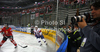 Photographers observing play from behind glass wall during match of IIHF Ice hockey World championship Division 1 Group A between Slovenia and Hungary. Match between Slovenia and Hungary of IIHF Ice hockey World championship Division 1 Group A was held in Stozice Arena in Ljubljana, Slovenia, on Wednesday, 18th of April 2012.
