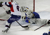 Ziga Jeglic (no.8) of Slovenia, Igor Karpenko (no.1) of Ukraine  and Yevgen Pastukh (no.27) of Ukraine  during match of IIHF Ice hockey World championship Division 1 Group A between Slovenia and Ukrain. Match between Slovenia and Ukrain of IIHF Ice hockey World championship Division 1 Group A was held in Stozice Arena in Ljubljana, Slovenia, on Thursday, 19th of April 2012.
