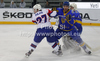 Rok Pajic (no.27) of Slovenia (L) and Oleksandr Pobiedonostsev (no.14) of Ukraine  (M) in front of goalie Igor Karpenko (no.1) of Ukraine  (R) during match of IIHF Ice hockey World championship Division 1 Group A between Slovenia and Ukrain. Match between Slovenia and Ukrain of IIHF Ice hockey World championship Division 1 Group A was held in Stozice Arena in Ljubljana, Slovenia, on Thursday, 19th of April 2012.
