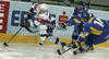 Robert Sabolic (no.25) of Slovenia (L) is being chased by Oleksandr Pobiedonostsev (no.14) of Ukrainee  (R) and Vitaliy Donika (no.24) of Ukrainee  (M) during match of IIHF Ice hockey World championship Division 1 Group A between Slovenia and Ukraine. Match between Slovenia and Ukraine of IIHF Ice hockey World championship Division 1 Group A was held in Stozice Arena in Ljubljana, Slovenia, on Thursday, 19th of April 2012.
