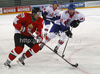Janos Vas (no.21) of Hungary (L), David Phillips (no.13) of Great Britain (R) and Robert Lachowicz (no.15) of Great Britain (M) during match of IIHF Ice hockey World championship Division 1 Group A between Great Britain and Hungary. Match between Great Britain and Hungary of IIHF Ice hockey World championship Division 1 Group A was held in Stozice Arena in Ljubljana, Slovenia, on Saturday, 21st of April 2012.
