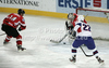 Fabian Weinhandl (no.1) of Austria and Rok Pajic (no.27) of Slovenia during match of IIHF Ice hockey World championship Division 1 Group A between Slovenia and Austria. Match between Slovenia and Austria of IIHF Ice hockey World championship Division 1 Group A was held in Stozice Arena in Ljubljana, Slovenia, on Saturday, 21st of April 2012.

