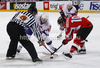 Rok Ticar (no.24) of Slovenia (L) and Daniel Oberkofler (no.10) of Austria (R) during match of IIHF Ice hockey World championship Division 1 Group A between Slovenia and Austria. Match between Slovenia and Austria of IIHF Ice hockey World championship Division 1 Group A was held in Stozice Arena in Ljubljana, Slovenia, on Saturday, 21st of April 2012.
