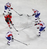 Thomas Hundertpfund (no.27) of Austria trying to go between Slovenian players Matej Hocevar (no.14), Bostjan Golicic (no.7), Andrej Tavzelj (no.4) and Sabahudin Kovacevic (no.20) during match of IIHF Ice hockey World championship Division 1 Group A between Slovenia and Austria. Match between Slovenia and Austria of IIHF Ice hockey World championship Division 1 Group A was held in Stozice Arena in Ljubljana, Slovenia, on Saturday, 21st of April 2012.
