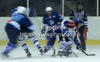 Players in bully trying to win puck during match of Rudi Hiti Ice hockey Summer league 2012 between VSV Villach and KHL Medvescak Zagreb. Match between VSV Villach and KHL Medvescak Zagreb was held in Bled Ice Arena in Bled, Slovenia, on Saturday, 18th of August 2012.
