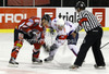 Rok Pajic (no.76) of Slovenia (R) and David Schuler (no.45) of Austria (L) in bully fighting for puck during match of EIHC Ice hockey tournament between Slovenia and Austria. Match between Slovenia and Austria was held in Ljubljana Hala Tivoli arena, Slovenia, on Saturday, 10th of November 2012.
