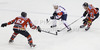 Blaz Gregorc (no.15) of Slovenia (M) between Matthias Trattnig (no.51) of Austria (L) and Michael Raffl (no.12) of Austria (R) during match of EIHC Ice hockey tournament between Slovenia and Austria. Match between Slovenia and Austria was held in Ljubljana Hala Tivoli arena, Slovenia, on Saturday, 10th of November 2012.

