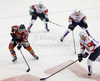 Michael Raffl (no.12) of Austria (L) between Ziga Pance (no.19) of Slovenia (M), Anze Kopitar (no.11) of Slovenia (2nd from R) and Sabahudin Kovacevic (no.86) of Slovenia (R) during match of EIHC Ice hockey tournament between Slovenia and Austria. Match between Slovenia and Austria was held in Ljubljana Hala Tivoli arena, Slovenia, on Saturday, 10th of November 2012.
