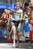 Roel Paulissen of Belgium carries his broken bike after crashing with Christoph Sauser of Switzerland at the finish sprint of the 2008 UCI Mountain Bike Marathon World Championships at Villabassa, Italy, Saturday, July 5, 2008. Paulissen won ahead of Sauser.
