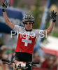 Second placed Esther Suss of Switzerland celebrates her medal in during women UCI Mountain bike Marathon World Championships race in Graz - Stattegg, Austria. 84km long race was held in Graz - Stattegg, Austria, on 23rd of August 2009.
