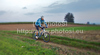 Mountain biker riding his bike through fields near his home city of Kranj, Slovenia, on late autumn afternoon of Sunday, 10th of October 2010.
