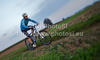 Mountain biker riding his bike through fields near his home city of Kranj, Slovenia, on late autumn afternoon of Sunday, 10th of October 2010.
