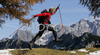 Nordicwalking in mountains near Vrsic, Slovenia. Central Julian Alps with Skrlatica, Prisojnik, Kukova spica and Vrsic are seen from 1909m high Slemenova Spica. Fall brought first snow in mountains around Vrsic, Slovenia. Trees in mountains above Kranjska gora, Slovenia, painted their leaves into colorful fall colors, while first snow in mountains put some more contrast to already beautiful and peaceful landscape.

