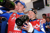 Manfred Moelgg of Italy, left, and Denise Karbon celebrate after the alpine ski World Cup finals in Bormio, Italy, Saturday, March 15, 2008.
