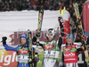 Winner Mario Matt of Austria (M), second placed Jean-Baptiste Grange of France (R) and third placed Manfred Moelgg of Italy (R) celebrating their success in finish of second run of men slalom World Cup race in Schladming, Austria. Slalom race of traditional Schladming Night race and Men FIS Alpine skiing World Cup was held in Schladming, Austria, on 22nd of January 2008.
