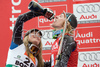 Lindsey Vonn of the United States (L) pours sparkling wine to her teammate Ted Ligety (R) at the alpine ski World Cup finals in Bormio, Italy, Friday, March 14, 2008.
