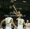 Lior Eliyahu (no.11) of Caja Laboral shooting over Edin Bavcic (no.9) of Union Olimpija (L) and Jaka Klobucar (no.8) of Union Olimpija (R) during match of Basketball Euroleague between Union Olimpija, Ljubljana, Slovenia and Caja Laboral, Vitoria, Spain. Match between Union Olimpija and Caja Laboral was played on 5th of November 2009 in Tivoli Arena in Ljubljana, Slovenia.
