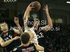 Tiago SPlitter (no.21) of Caja Laboral (R) and Sani Becirovic (no.7) of Union Olimpija (L) jumping for ball during match of Basketball Euroleague between Union Olimpija, Ljubljana, Slovenia and Caja Laboral, Vitoria, Spain. Match between Union Olimpija and Caja Laboral was played on 5th of November 2009 in Tivoli Arena in Ljubljana, Slovenia.
