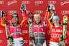 From left: Second placed Viktoria Rebensburg of Germany, winner Tanja Poutiainen of Finland and third placed Kathrin Hoelzl of Germany celebrate on the podium after the womens alpine ski World Cup Giant Slalom race in Cortina d Ampezzo, Italy, Sunday, January 24, 2010.
