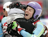 Winner Tina Maze of Slovenia (R) gets congratulations from her coach Andrea Massi (L) in finish of second run of last Women Giant slalom race of Audi FIS alpine skiing World Cup, which was held on Kandahar course in Garmisch-Partenkirchen, Germany. Last Giant slalom race of Women Audi FIS Alpine skiing World Cup 2009-10, was held on Thursday, 11th of March 2010 in Garmisch-Partenkirchen, Germany.
