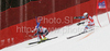 Sandro Viletta of Switzerland (R) skiing while his opponent Ivica Kostelic of Croatia (L) crashing in team race of Audi FIS alpine skiing World Cup, which was held on Kandahar course in Garmisch-Partenkirchen, Germany. Team race of Audi FIS Alpine skiing World Cup 2009-10, was held on Sunday, 14th of March 2010 in Garmisch-Partenkirchen, Germany.
