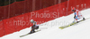 Ondrej Bank of Czech (L) and Marc Gini of Switzerland (R) skiing in team race of Audi FIS alpine skiing World Cup, which was held on Kandahar course in Garmisch-Partenkirchen, Germany. Team race of Audi FIS Alpine skiing World Cup 2009-10, was held on Sunday, 14th of March 2010 in Garmisch-Partenkirchen, Germany.

