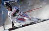 BAUMANN Romed (AUT)  attacks a control gate whilst competing in  the FIS alpine skiing world cup giant slalom race on the Bellevarde race piste Val dIsere.
