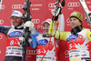 Winner Beat Feuz of Switzerland (middle), second placed Bode Miller of USA (left) and third placed Kjetil Jansrud of Norway (right) at the flower ceremony of Men Super-G race of Audi FIS alpine skiing World Cup in Val Gardena, Italy. Super-G race of Men Audi FIS Alpine skiing World Cup 2011 / 2012, was held on Friday, 16th of December 2011, on Saslong course in Val Gardena, Italy. 
