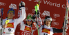 Winner Marcel Hirscher of Austria (M), second placed Giuliano Razzoli of Italy (L) and third placed Felix Neureuther of Germany (R) celebrate their medals won in men slalom race of Audi FIS Alpine skiing World cup in Alta Badia, Italy. Men slalom race of Audi FIS Alpine skiing World cup was held on Gran Risa course in Alta Badia, Italy on Monday, 19th of December 2011.
