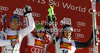 Winner Marcel Hirscher of Austria (M), second placed Giuliano Razzoli of Italy (L) and third placed Felix Neureuther of Germany (R) celebrate their medals won in men slalom race of Audi FIS Alpine skiing World cup in Alta Badia, Italy. Men slalom race of Audi FIS Alpine skiing World cup was held on Gran Risa course in Alta Badia, Italy on Monday, 19th of December 2011.
