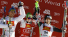 Winner Marcel Hirscher of Austria (M), second placed Giuliano Razzoli of Italy (L) and third placed Felix Neureuther of Germany (R) celebrate their medals won in men slalom race of Audi FIS Alpine skiing World cup in Alta Badia, Italy. Men slalom race of Audi FIS Alpine skiing World cup was held on Gran Risa course in Alta Badia, Italy on Monday, 19th of December 2011.
