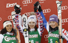 Winner Anna Fenninger of Austria (M), second placed Federica Brignone of Italy (L) and third placed Tessa Worley of France (R) celebrate their medals won in women giant slalom race of Audi FIS Alpine skiing World cup in Lienz, Austria. Women giant slalom race of Audi FIS Alpine skiing World cup was held in Lienz, Austria on Wednesday, 28th of December 2011.
