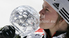 Overall giant slalom World cup winner Viktoria Rebensburg of Germany celebrates her trophy after end of last women giant slalom race of Audi FIS Alpine skiing World cup finals in Schladming, Austria. Women giant slalom race of Audi FIS Alpine skiing World cup finals was held in Schladming, Austria, on Sunday, 18th of March 2012.
